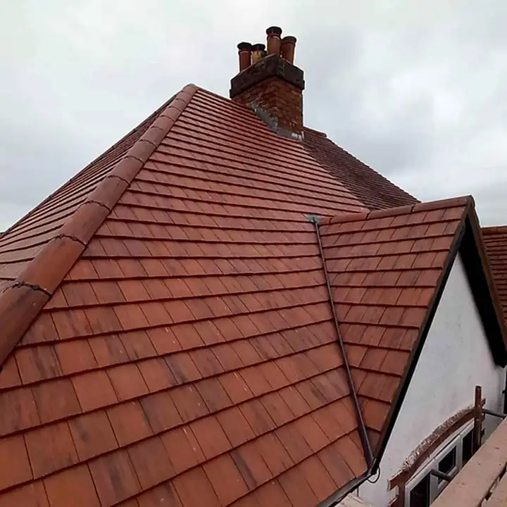 Clay plain tile re-roof around a chimney