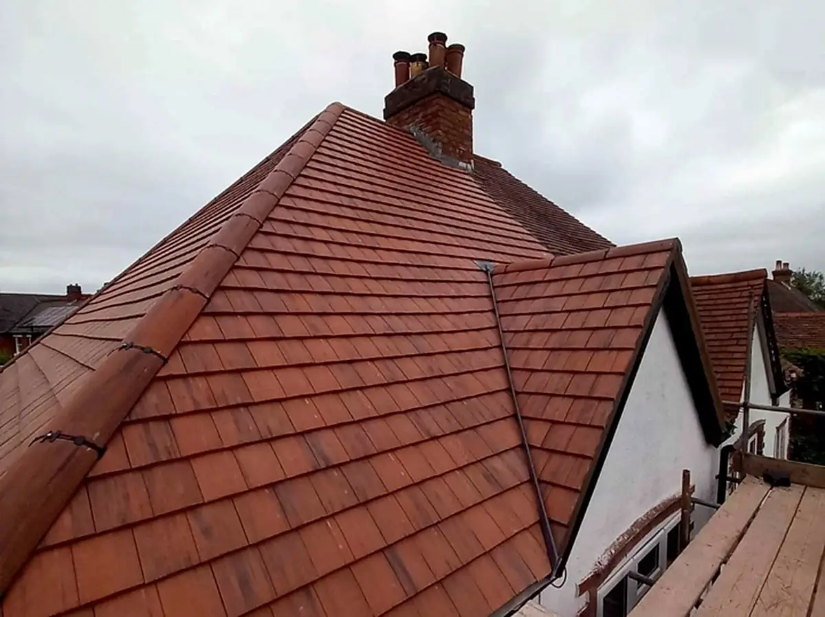 Clay plain tile re-roof around a chimney