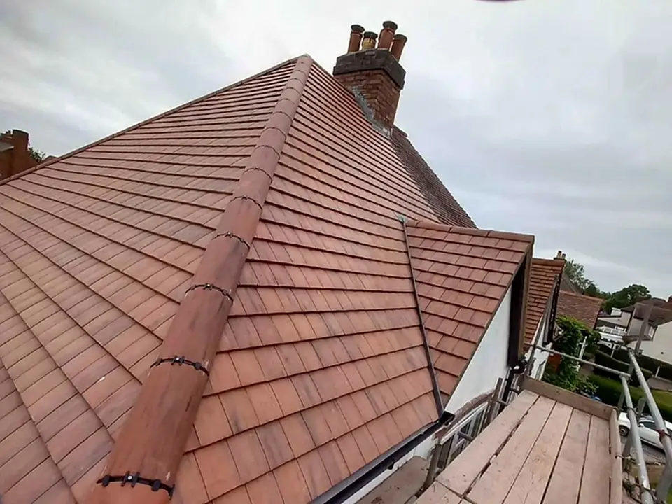 Clay plain tile re-roof with tiled hips