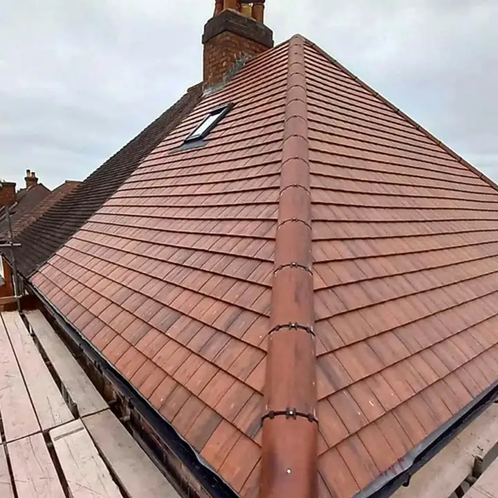 Clay plain tile re-roof with a Velux roof window