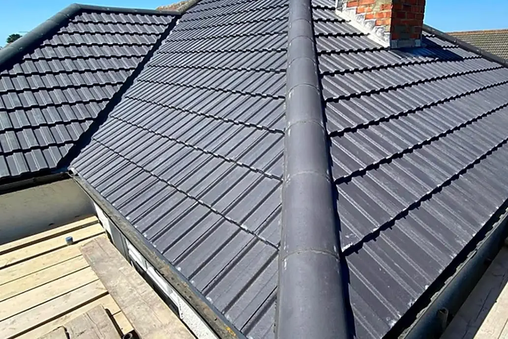 Concrete tile re-roof on a hip roof