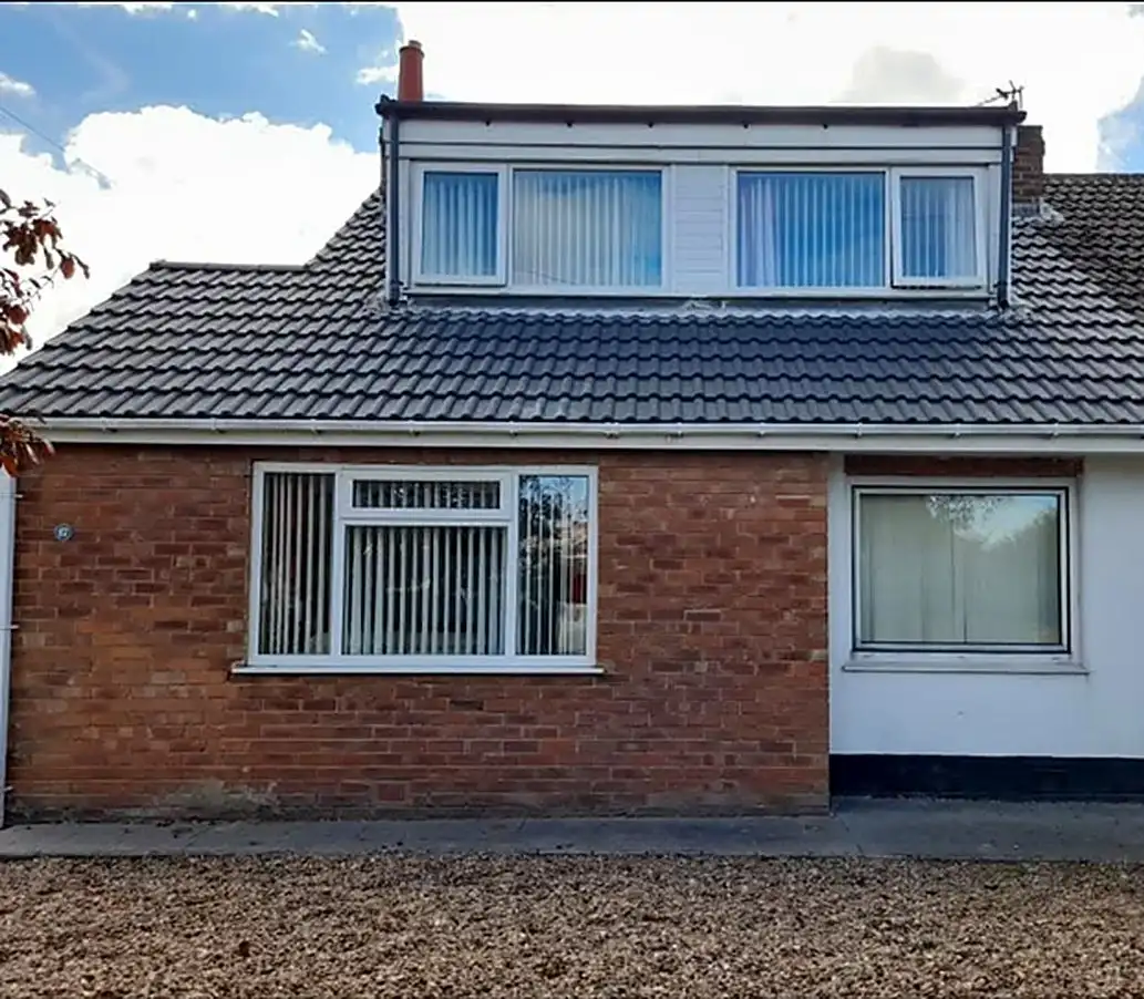Front of a house with its completed re-roof